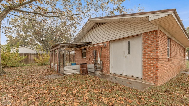 319 Stephans Ln, Corning, AR 72422 - back of property with brick siding and fence