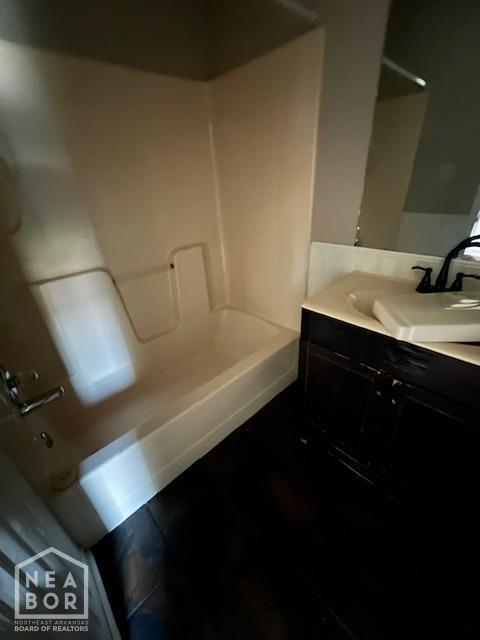 1213 Pauline St, Trumann, AR 72472 - full bath featuring bathing tub / shower combination, vanity, and wood finished floors