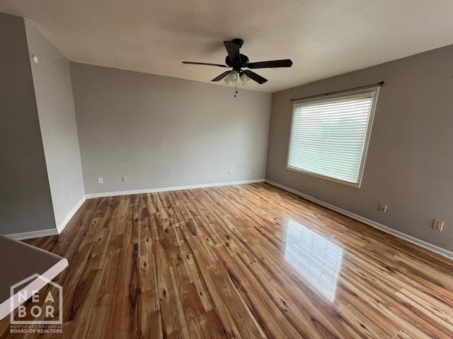 1213 Pauline St, Trumann, AR 72472 - spare room featuring a ceiling fan and wood finished floors