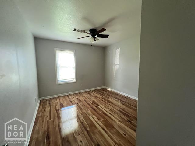 1213 Pauline St, Trumann, AR 72472 - unfurnished room featuring wood finished floors and ceiling fan