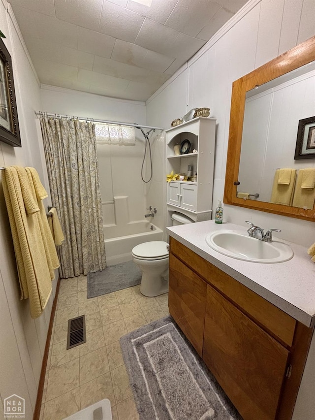 bathroom featuring vanity, toilet, visible vents, and shower / bath combination with curtain