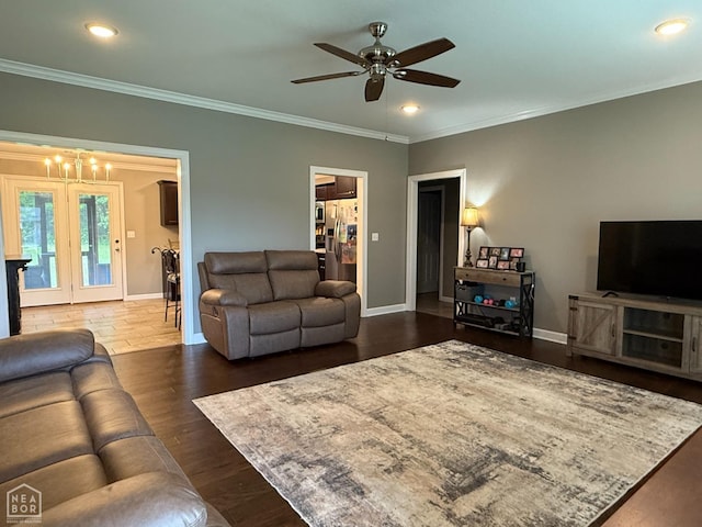 1303 William Hall Dr, Paragould, AR 72450 - living area with baseboards, crown molding, ceiling fan, a chandelier, and recessed lighting