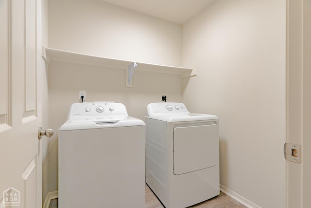 5405 Yukon Dr, Jonesboro, AR 72405 - washroom with independent washer and dryer and light wood finished floors