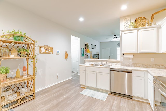 5405 Yukon Dr, Jonesboro, AR 72405 - kitchen with appliances with stainless steel finishes, light wood finished floors, a ceiling fan, white cabinets, and recessed lighting