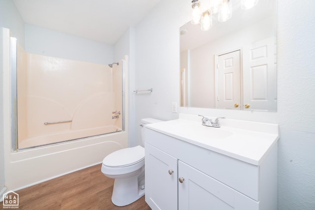 431 Affinity St, Hoxie, AR 72433 - bathroom with toilet, wood finished floors, vanity, and shower / tub combination