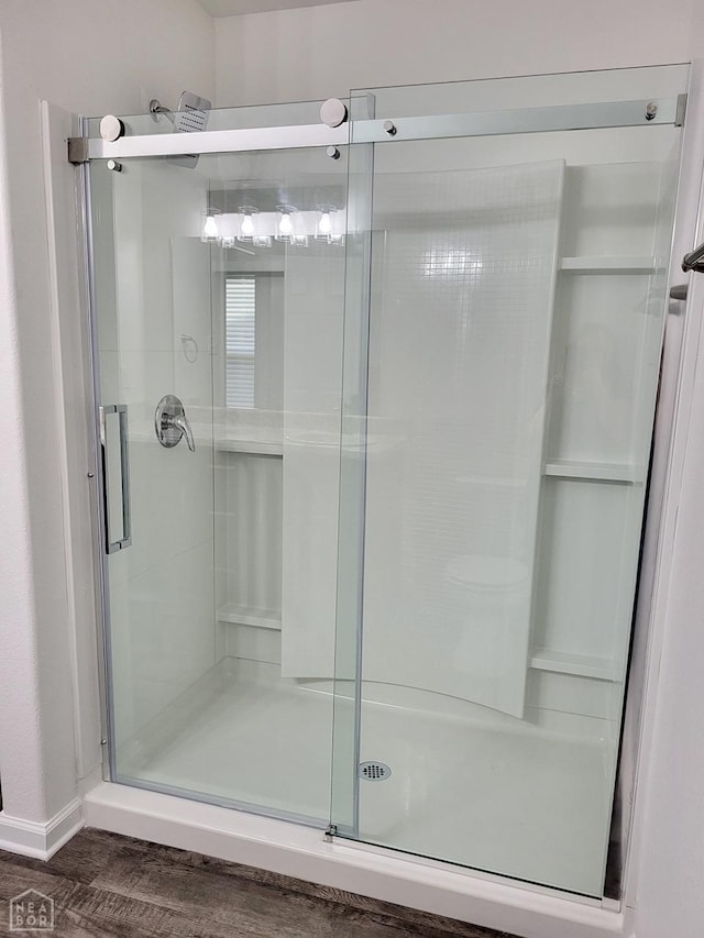 4909 Prospector Dr, Jonesboro, AR 72405 - full bathroom with a shower stall and wood finished floors