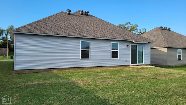 4909 Prospector Dr, Jonesboro, AR 72405 - rear view of property with roof with shingles and a lawn