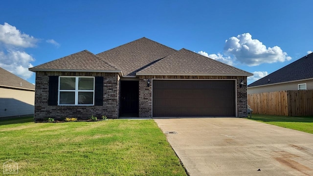 4909 Prospector Dr, Jonesboro, AR 72405 - view of front of home with brick siding, a garage, driveway, and a shingled roof