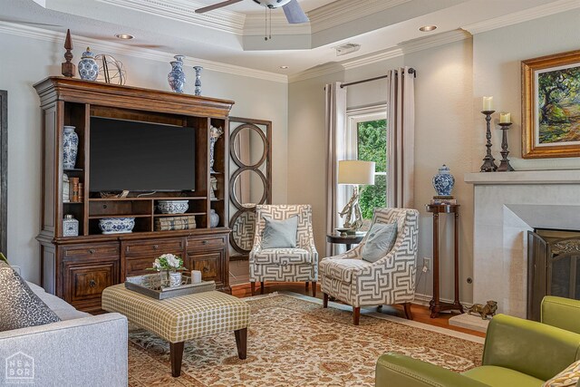 15 Plantation Oaks Ln, Jonesboro, AR 72401 - sitting room with wood finished floors, a ceiling fan, ornamental molding, a raised ceiling, and recessed lighting