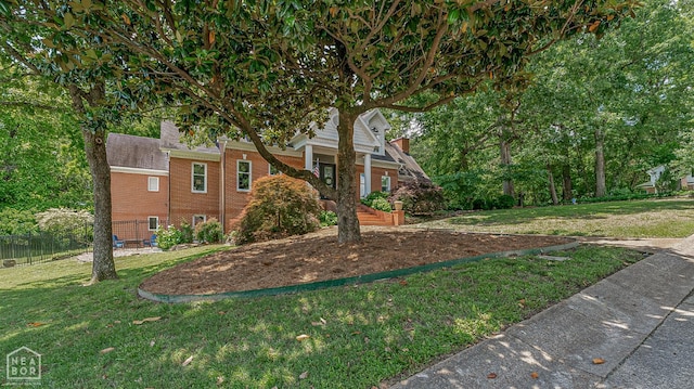 15 Plantation Oaks Ln, Jonesboro, AR 72401 - view of front of home featuring brick siding and a chimney