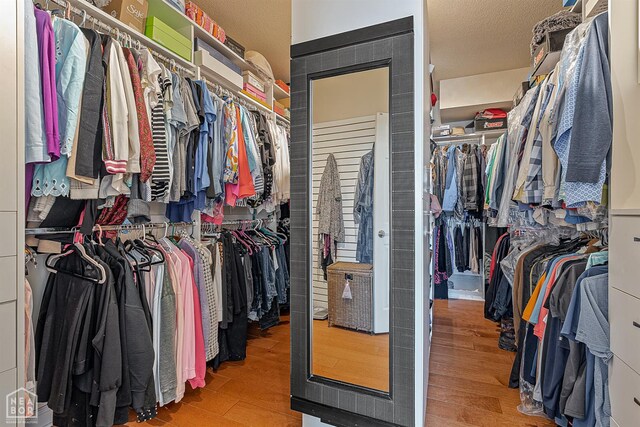 15 Plantation Oaks Ln, Jonesboro, AR 72401 - walk in closet featuring wood finished floors