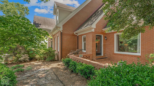 15 Plantation Oaks Ln, Jonesboro, AR 72401 - view of front of house featuring brick siding and a shingled roof