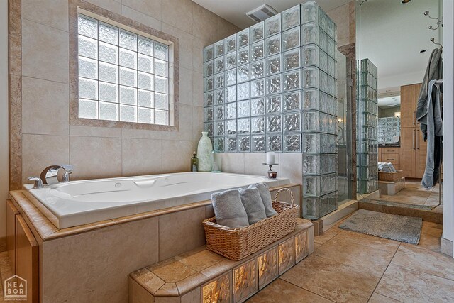 15 Plantation Oaks Ln, Jonesboro, AR 72401 - full bath featuring tile walls, a bath, and a tile shower