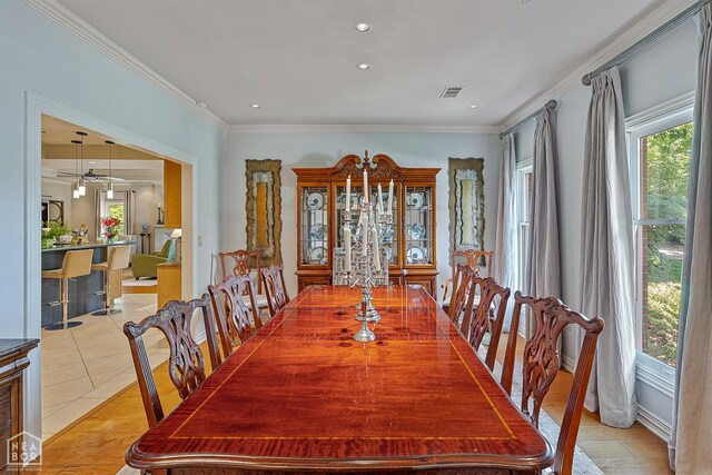 15 Plantation Oaks Ln, Jonesboro, AR 72401 - dining space with healthy amount of natural light, ornamental molding, light tile patterned flooring, and recessed lighting