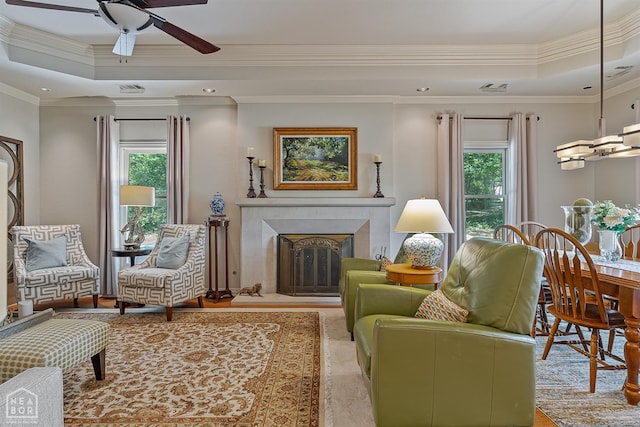 15 Plantation Oaks Ln, Jonesboro, AR 72401 - living area with plenty of natural light, a tray ceiling, a ceiling fan, crown molding, and a high end fireplace