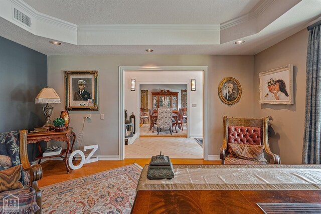 15 Plantation Oaks Ln, Jonesboro, AR 72401 - hallway with ornamental molding, a raised ceiling, recessed lighting, and baseboards