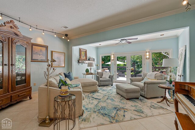 15 Plantation Oaks Ln, Jonesboro, AR 72401 - living room with french doors, track lighting, light tile patterned flooring, ornamental molding, and ceiling fan