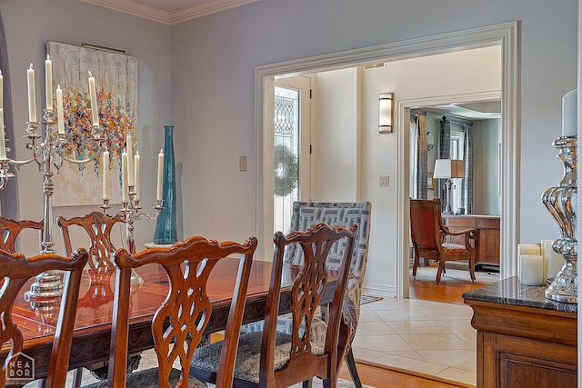 15 Plantation Oaks Ln, Jonesboro, AR 72401 - dining area featuring crown molding, light tile patterned flooring, and baseboards