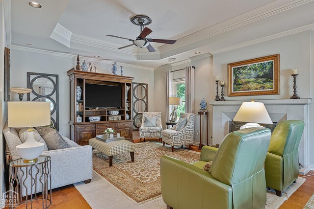 15 Plantation Oaks Ln, Jonesboro, AR 72401 - living area featuring ceiling fan, a raised ceiling, crown molding, and wood finished floors