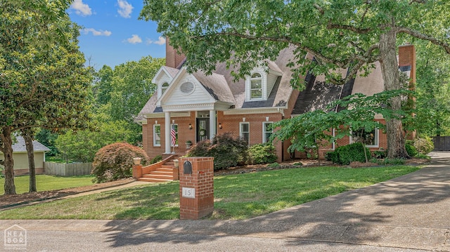 15 Plantation Oaks Ln, Jonesboro, AR 72401 - view of front of house with brick siding and roof with shingles