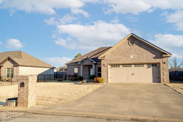 109 Harper Dr, Brookland, AR 72417 - view of front of property featuring brick siding, an attached garage, and concrete driveway