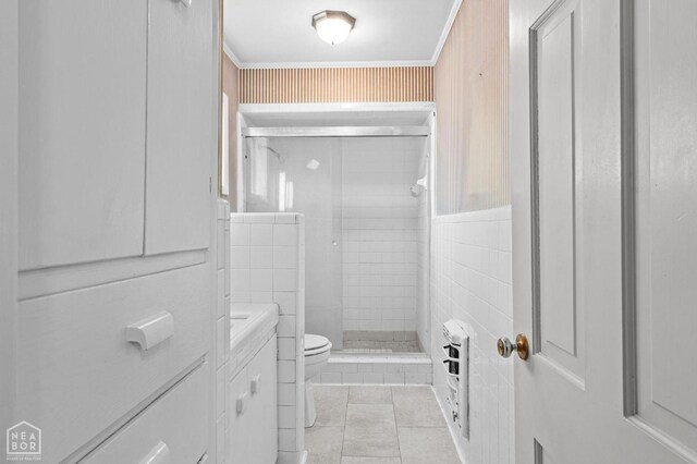 815 NW 3rd St, Walnut Ridge, AR 72476 - full bath featuring a shower stall, vanity, ornamental molding, toilet, and tile patterned floors