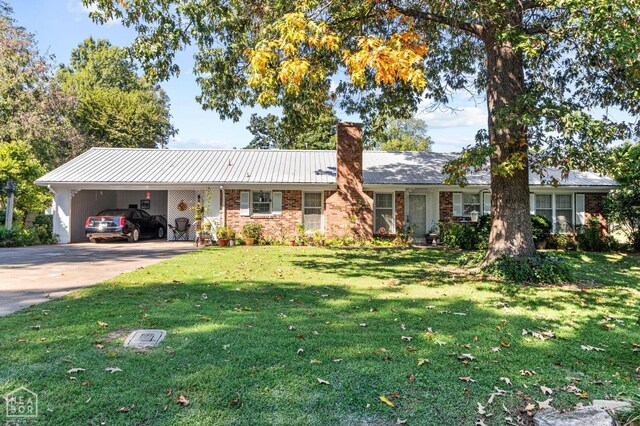 815 NW 3rd St, Walnut Ridge, AR 72476 - ranch-style house with a carport, a front lawn, brick siding, a chimney, and concrete driveway
