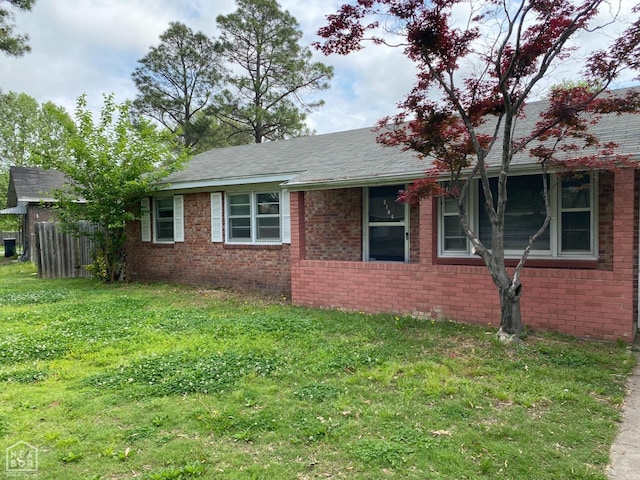 2104 Parkside Dr, Jonesboro, AR 72401 - view of side of home featuring a yard and brick siding