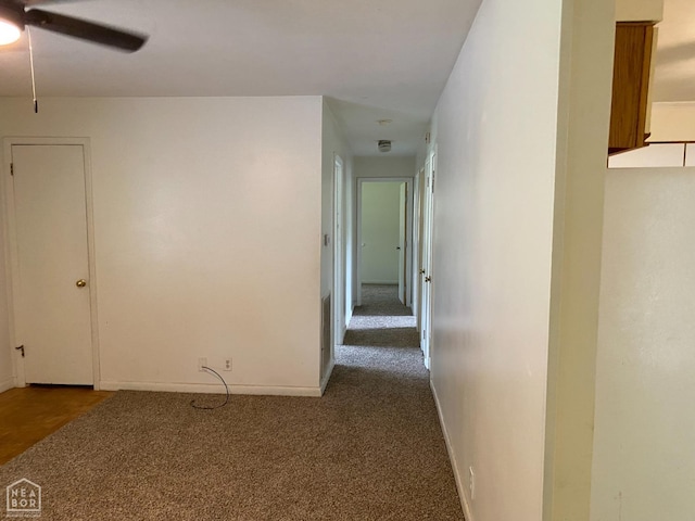 2104 Parkside Dr, Jonesboro, AR 72401 - empty room with a ceiling fan, baseboards, and dark colored carpet