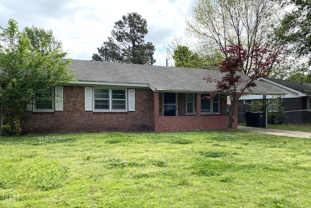 2104 Parkside Dr, Jonesboro, AR 72401 - view of property exterior featuring a lawn, fence, brick siding, and a carport