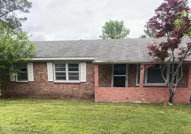 2104 Parkside Dr, Jonesboro, AR 72401 - view of front of property featuring brick siding, a shingled roof, and a front lawn