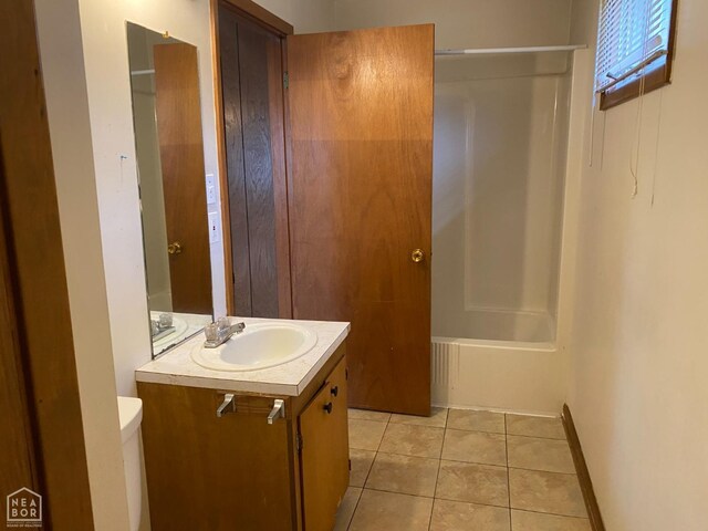 2104 Parkside Dr, Jonesboro, AR 72401 - bathroom with toilet, tile patterned floors, and vanity