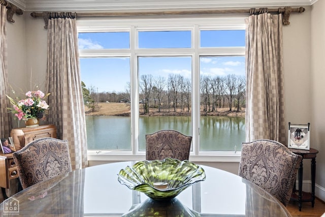 dining space with a water view