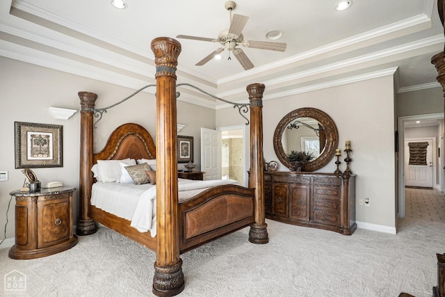carpeted bedroom featuring baseboards, ornamental molding, recessed lighting, a ceiling fan, and a tray ceiling