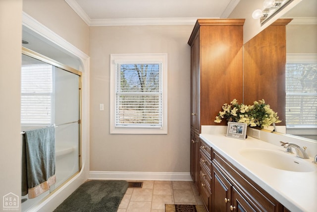 bathroom featuring an enclosed shower, crown molding, vanity, and tile patterned floors