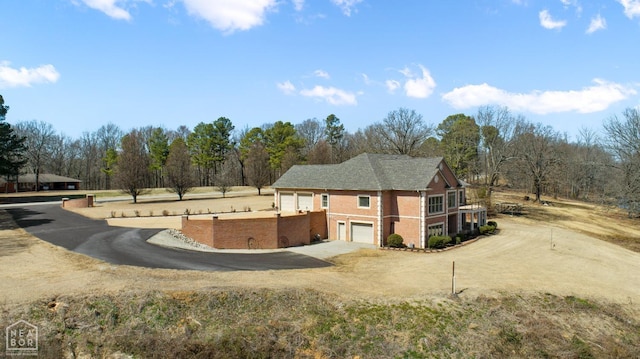 view of side of property featuring driveway