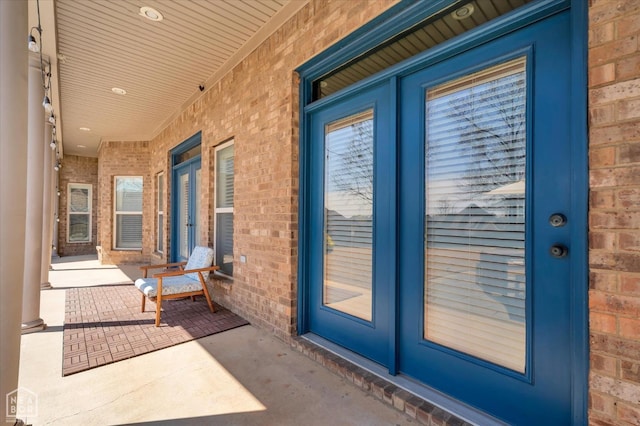 4024 Chapel Hill Dr, Jonesboro, AR 72404 - entrance to property with a porch, brick siding, and french doors