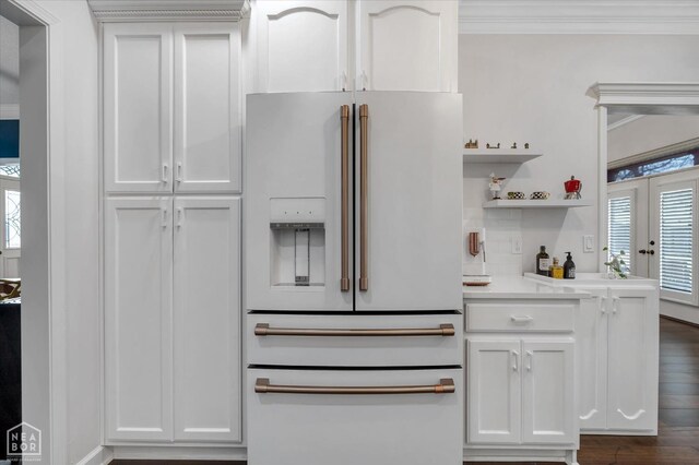 4024 Chapel Hill Dr, Jonesboro, AR 72404 - kitchen featuring white fridge with ice dispenser, healthy amount of natural light, light countertops, crown molding, and dark wood-style flooring