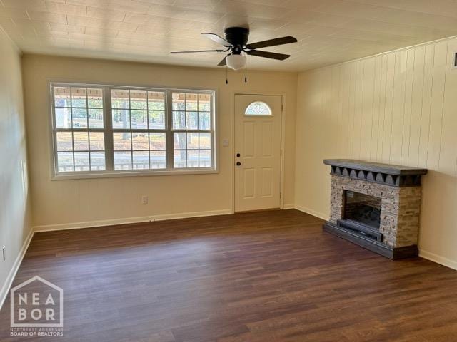 2187 Seagraves Rd, Pocahontas, AR 72455 - entrance foyer with a ceiling fan, dark wood-type flooring, and a fireplace