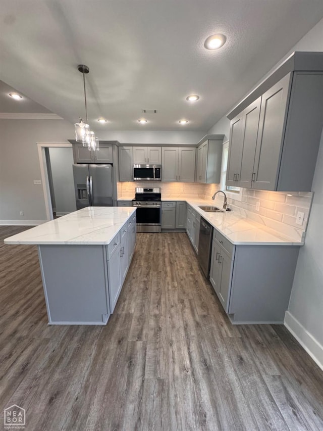 210 E College St, Bono, AR 72416 - kitchen with appliances with stainless steel finishes, gray cabinetry, a sink, baseboards, and dark wood finished floors
