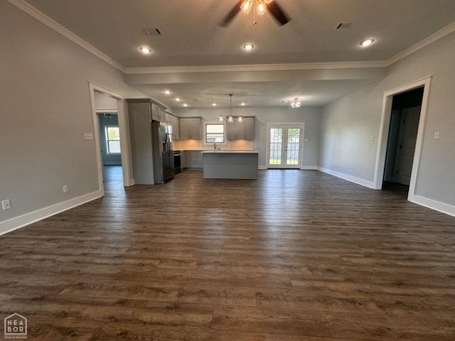 210 E College St, Bono, AR 72416 - unfurnished living room featuring crown molding, ceiling fan, dark wood finished floors, baseboards, and recessed lighting