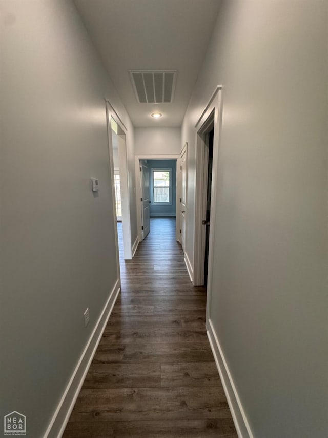 210 E College St, Bono, AR 72416 - hall featuring dark wood finished floors and baseboards