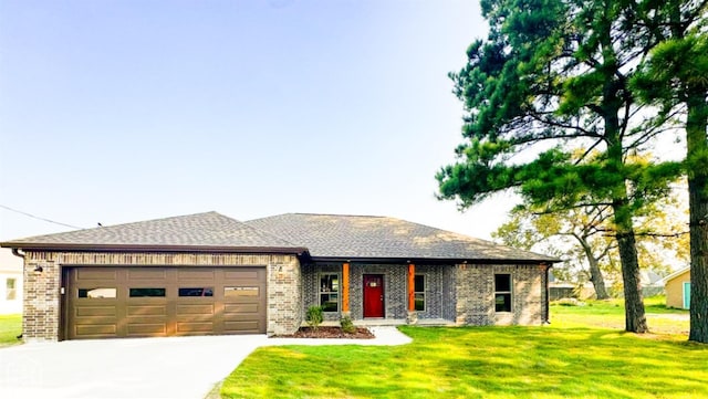 210 E College St, Bono, AR 72416 - view of front of house featuring brick siding, a garage, concrete driveway, a front yard, and roof with shingles