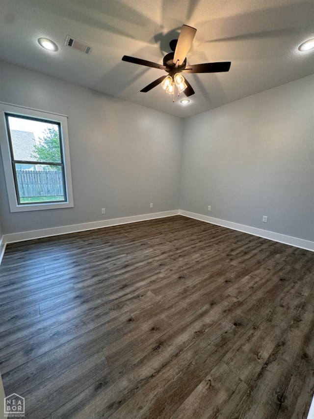 210 E College St, Bono, AR 72416 - unfurnished room featuring dark wood-style floors, ceiling fan, baseboards, and recessed lighting