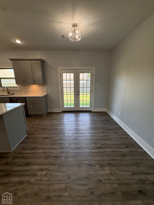 210 E College St, Bono, AR 72416 - kitchen with baseboards, french doors, dark wood-style floors, plenty of natural light, and recessed lighting