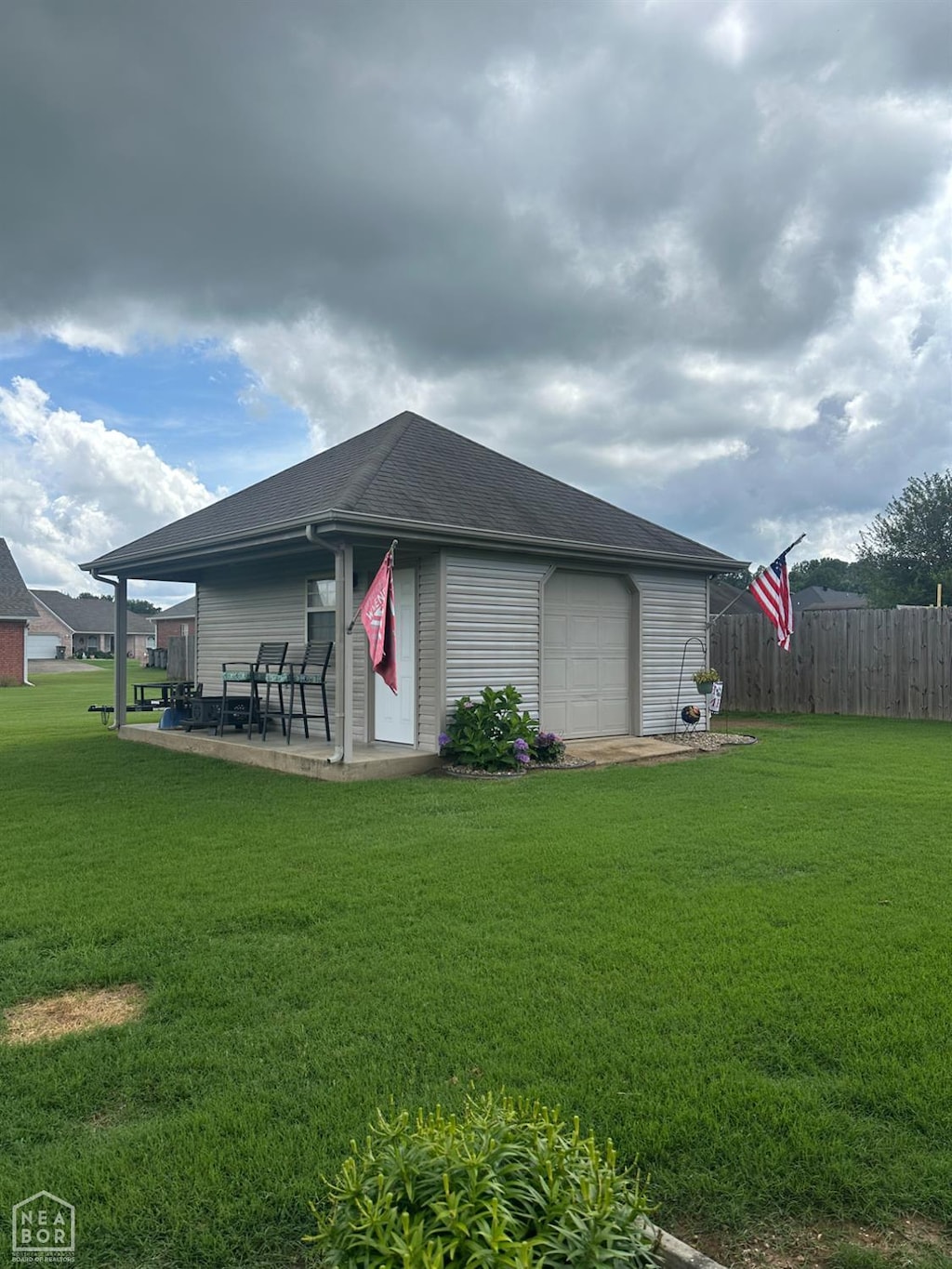 3006 Canterbury, Paragould, AR 72450 - view of side of home with a patio and roof with shingles