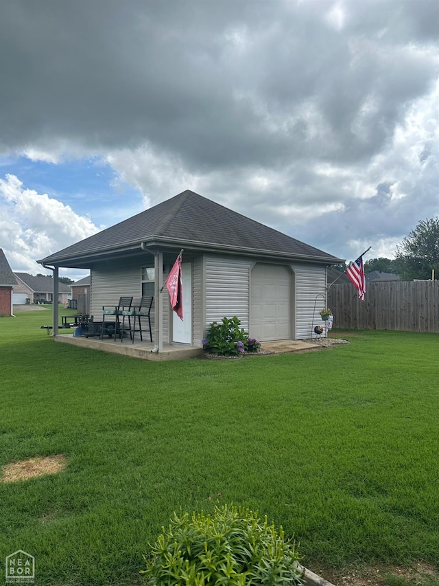 3006 Canterbury, Paragould, AR 72450 - view of side of home with a patio and roof with shingles