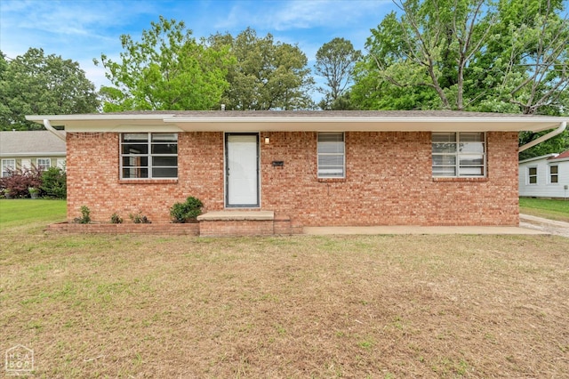 312 W College Ave, Jonesboro, AR 72401 - ranch-style home with brick siding and a front yard