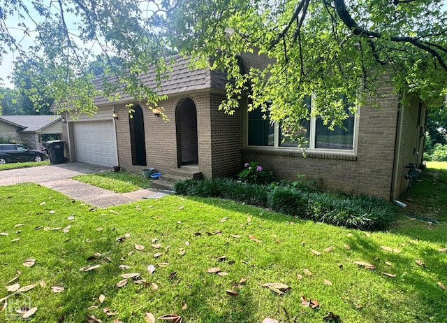 905 Locust Dr, Jonesboro, AR 72401 - view of front of property featuring brick siding, a front yard, driveway, and a garage