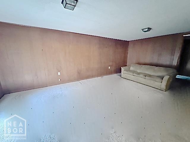 905 Locust Dr, Jonesboro, AR 72401 - unfurnished room featuring wooden walls